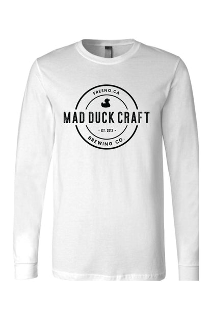 White long-sleeve cotton jersey tee featuring a black Mad Duck Craft Brewing Co. logo on the chest.