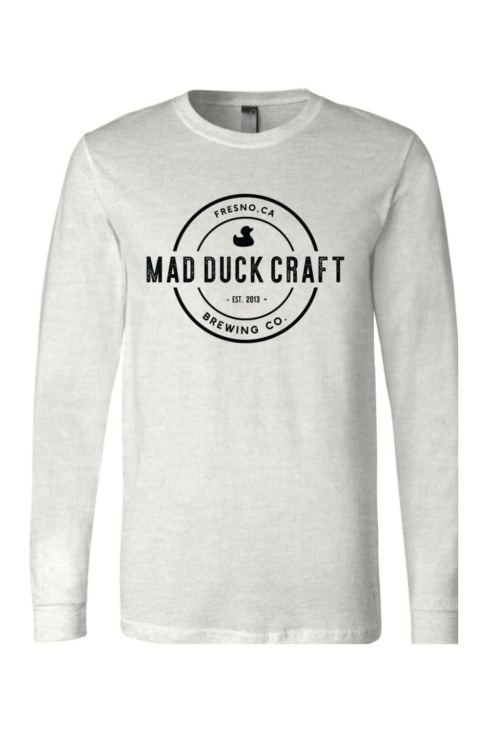 Light grey long sleeve jersey tee featuring a black Mad Duck Craft Brewing Co. circular logo on the chest.