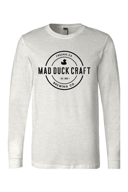 Light grey long sleeve jersey tee featuring a black Mad Duck Craft Brewing Co. circular logo on the chest.