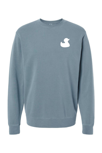 Blue pigment-dyed men's crewneck sweatshirt featuring a white rubber duck logo on the left chest.