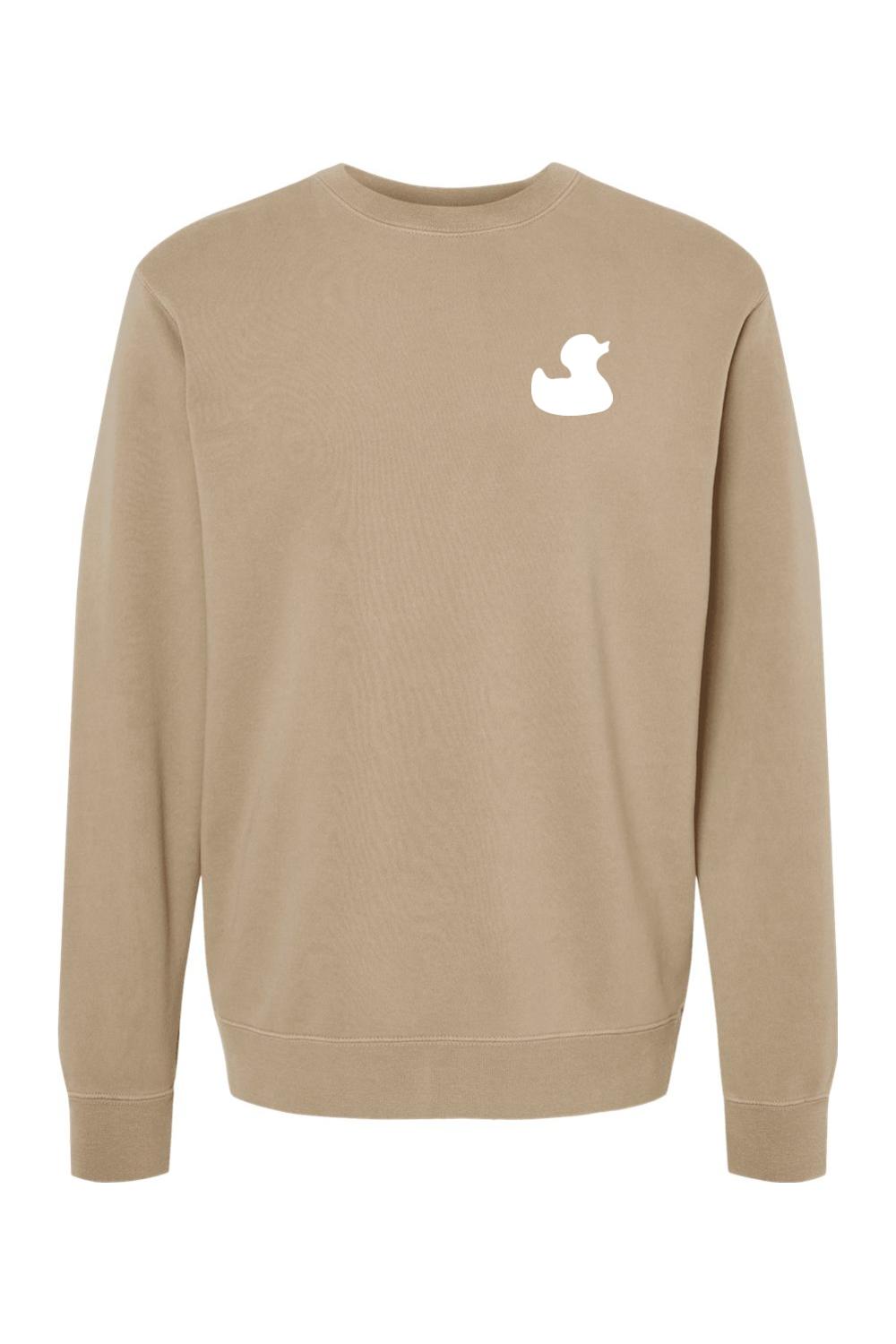 Tan pigment-dyed men's crewneck sweatshirt featuring a white rubber duck logo on the left chest.