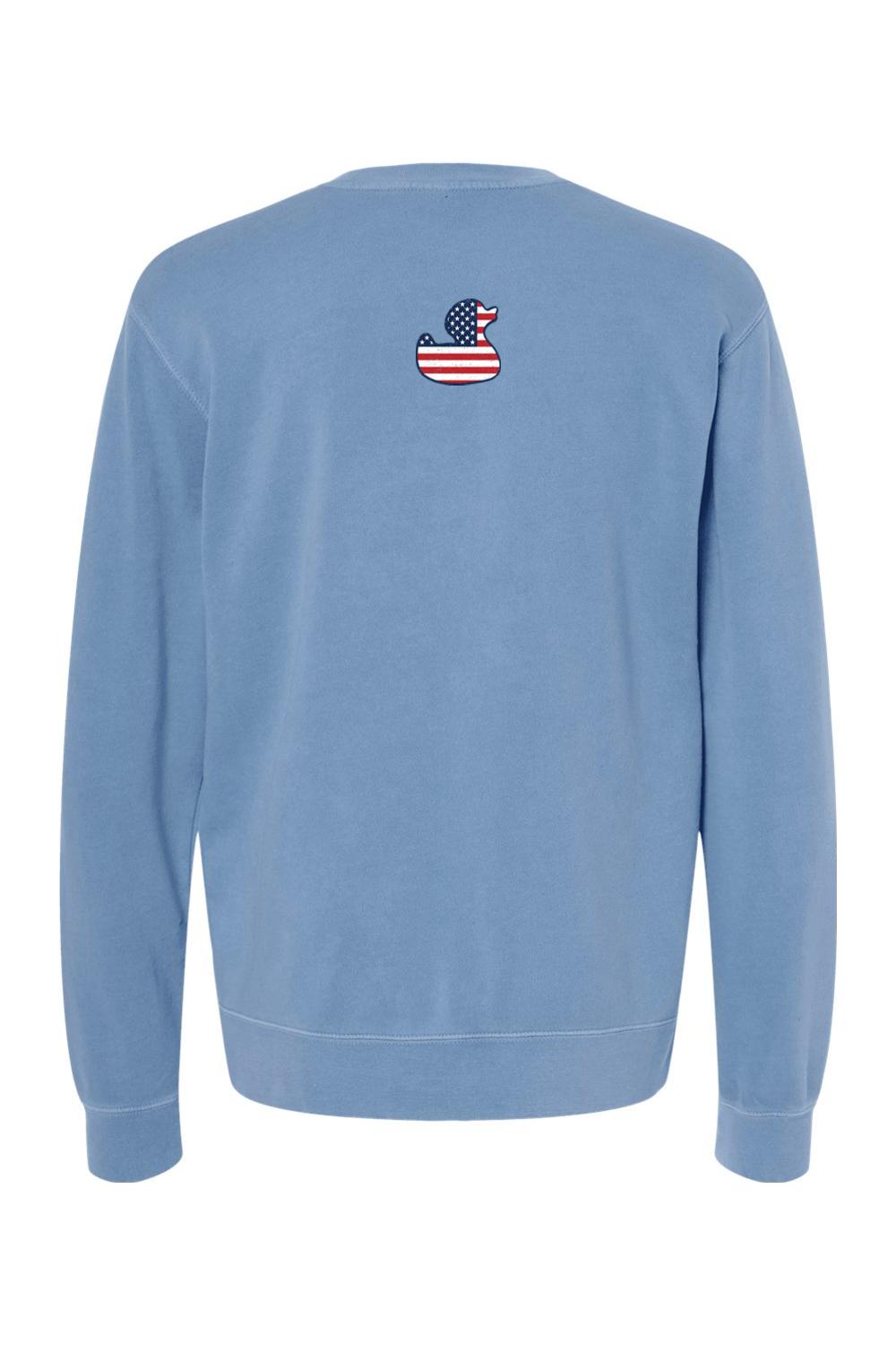 Blue pigment-dyed crewneck sweatshirt featuring a small American flag patterned rubber duck logo on the back.