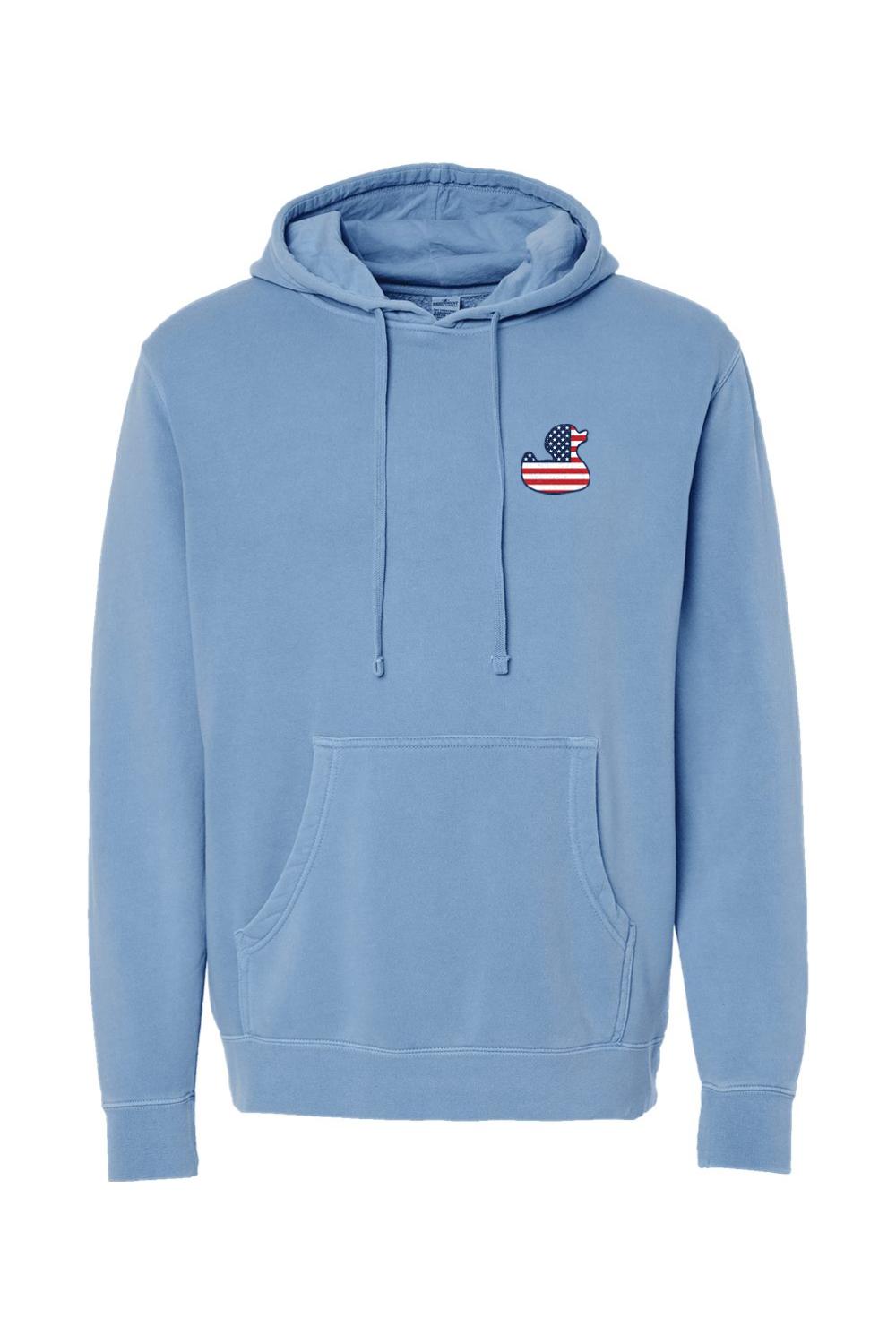 Light blue pigment-dyed hoodie with a red, white, and blue American flag duck logo on the chest.