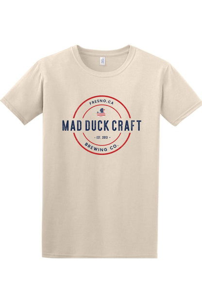 Beige short-sleeve cotton t-shirt featuring a red, white, and blue Mad Duck Craft Brewing Co. logo on the chest.