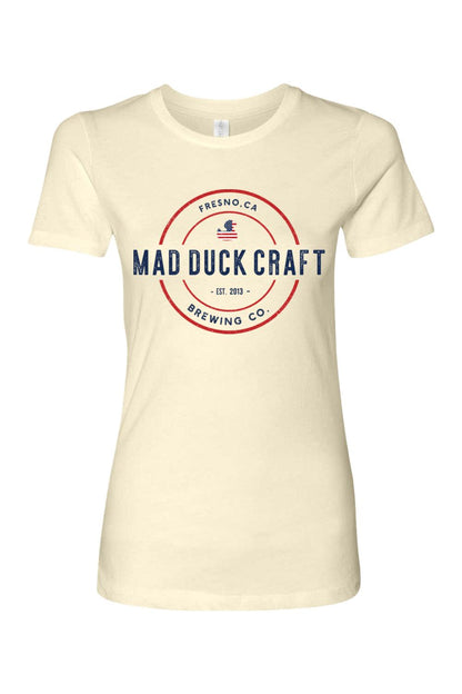 Cream-colored women's cotton t-shirt featuring a red, white, and blue Mad Duck Craft Brewing Co. logo graphic.