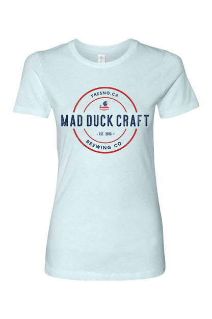 Light blue women's cotton t-shirt featuring a red, white, and blue Mad Duck Craft Brewing Co. logo on the front.
