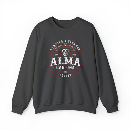 Dark gray unisex crewneck sweatshirt featuring a white and red Alma Cantina skull and sombrero graphic print.