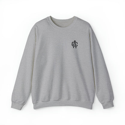 Grey heavy blend crewneck sweatshirt with a ribbed collar and small black logo on the left chest.