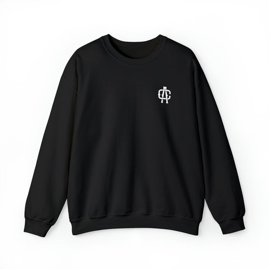 Black heavy blend crewneck sweatshirt with a white AC logo on the chest, featuring a ribbed knit collar and loose fit.