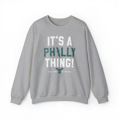 Grey heavy blend crewneck sweatshirt featuring It's A Philly Thing text with a liberty bell and lightning bolt design.