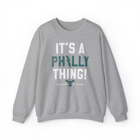 Grey heavy blend crewneck sweatshirt featuring It's A Philly Thing text with a liberty bell and lightning bolt design.