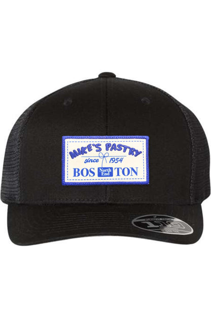 Black Mike's Pastry Flexfit 110 mesh-back cap with a blue and white rectangular logo patch on the front.