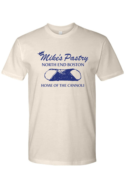 Cream-colored 100% cotton t-shirt featuring a blue Mike's Pastry North End Boston cannoli graphic on the chest.