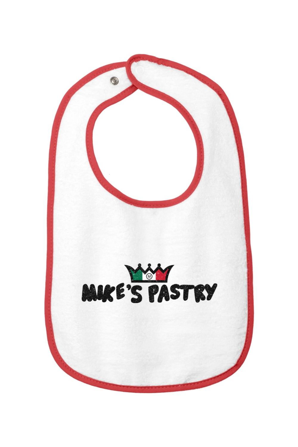White cotton terry baby bib with red trim and the Mike's Pastry Italian flag crown logo.