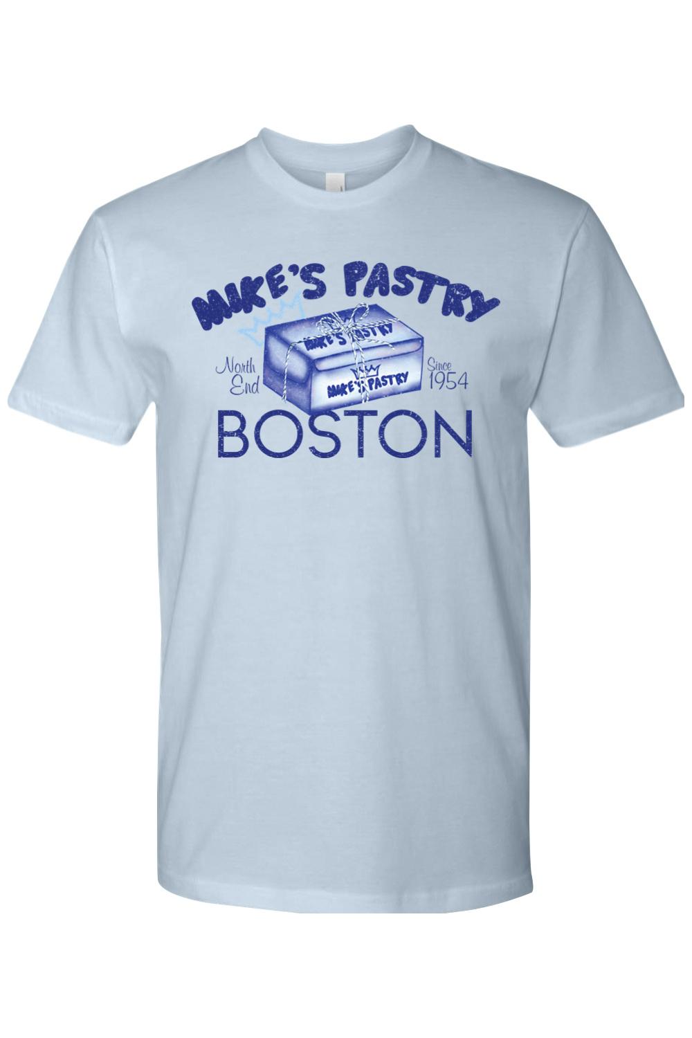 Light blue 100% cotton t-shirt featuring a blue Mike's Pastry Boston box graphic on the front.