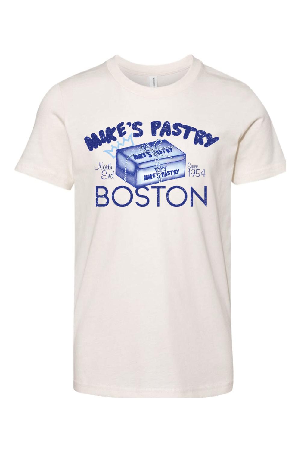Youth cream cotton t-shirt featuring a blue Mike's Pastry box graphic with Boston North End text.