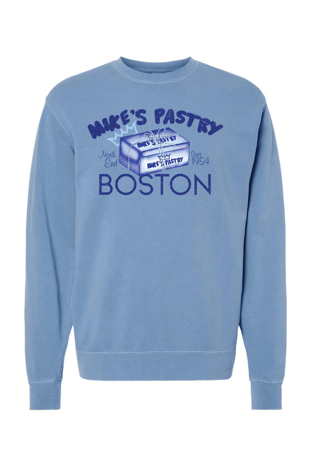 Blue pigment-dyed crewneck sweatshirt featuring a vintage Mike's Pastry Boston box graphic on the chest.