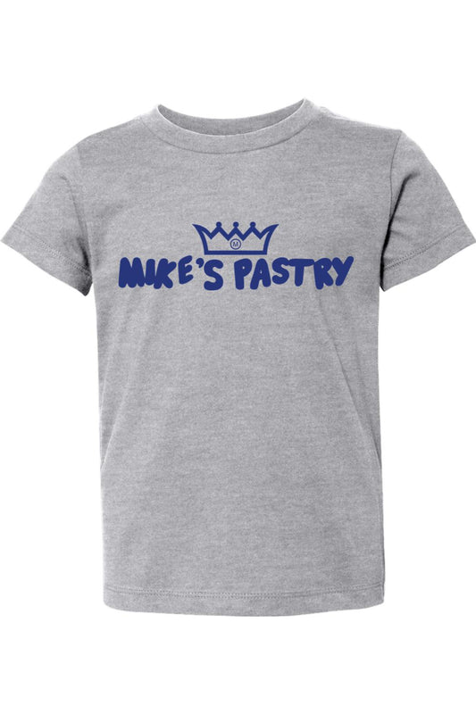 Grey toddler t-shirt featuring a blue Mike's Pastry crown logo and text on the chest, made of soft cotton.