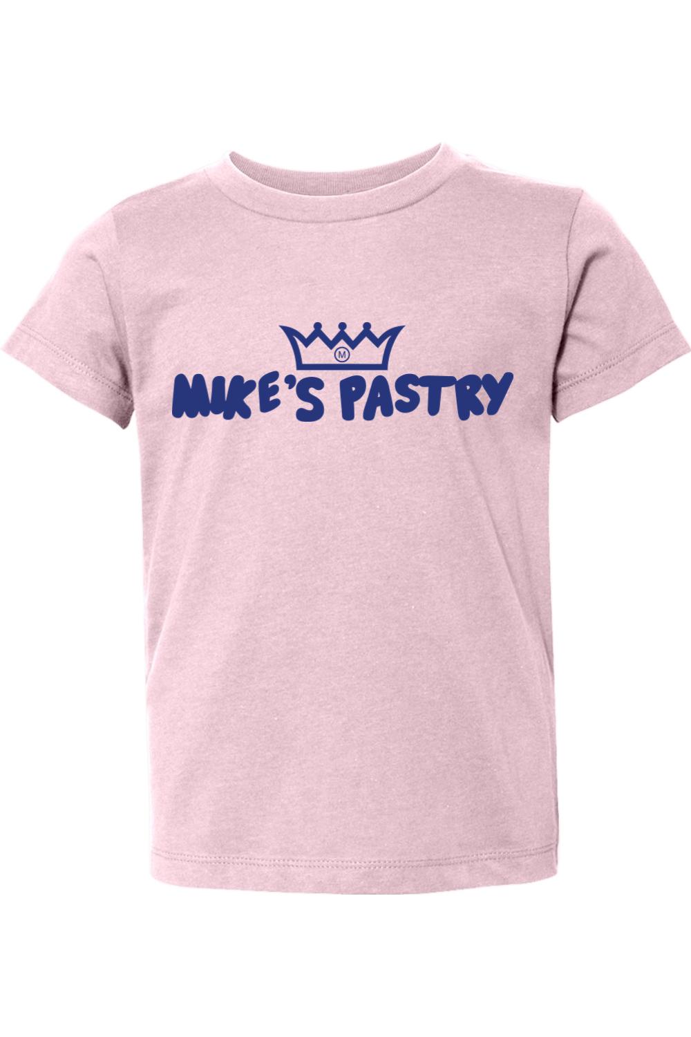 Soft pink toddler t-shirt featuring the blue Mike's Pastry logo and crown graphic on the chest.