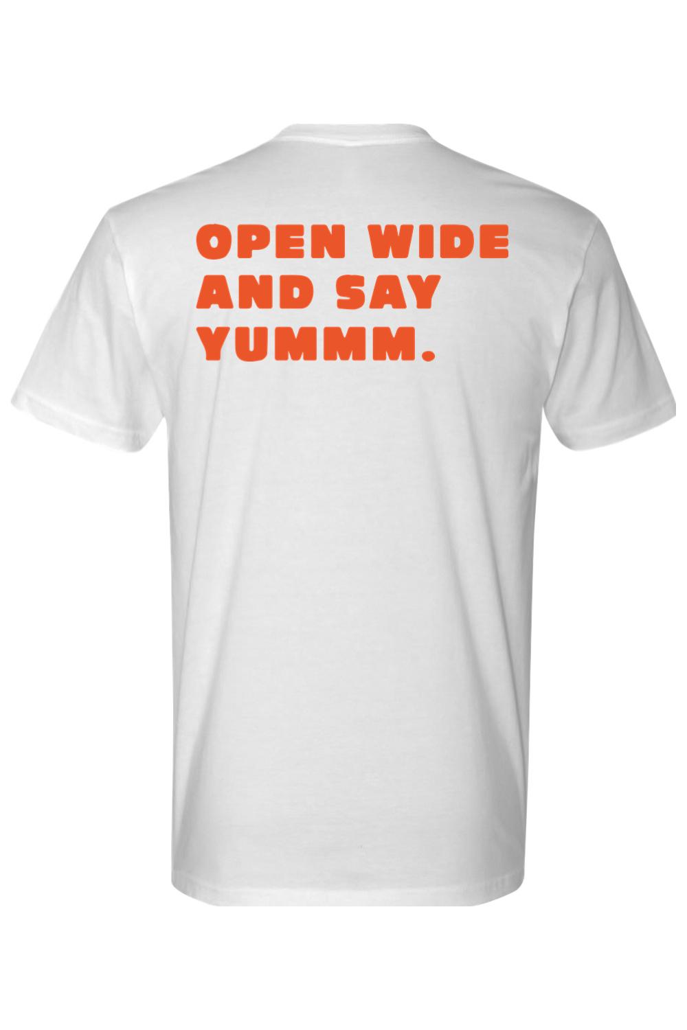 White cotton short-sleeve tee featuring the orange text Open Wide And Say Yummm on the back.
