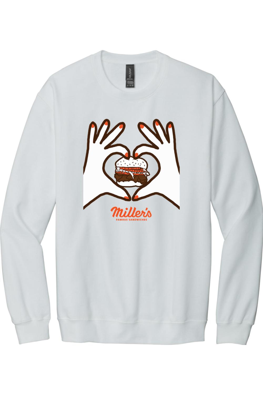 White crewneck sweatshirt featuring a graphic of hands forming a heart around a sandwich with Miller's branding.