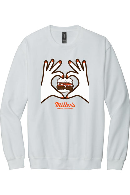 White crewneck sweatshirt featuring a graphic of hands forming a heart around a sandwich with Miller's branding.