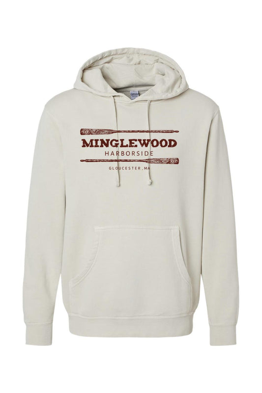 Pigment-dyed cream hooded sweatshirt with Minglewood Harborside oars graphic, front pouch pocket, and cotton blend.