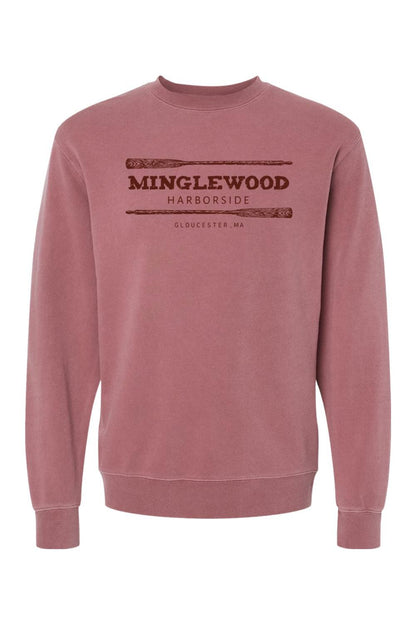 Dusty rose pigment-dyed crewneck sweatshirt featuring a Minglewood Harborside graphic with oars in dark brown.