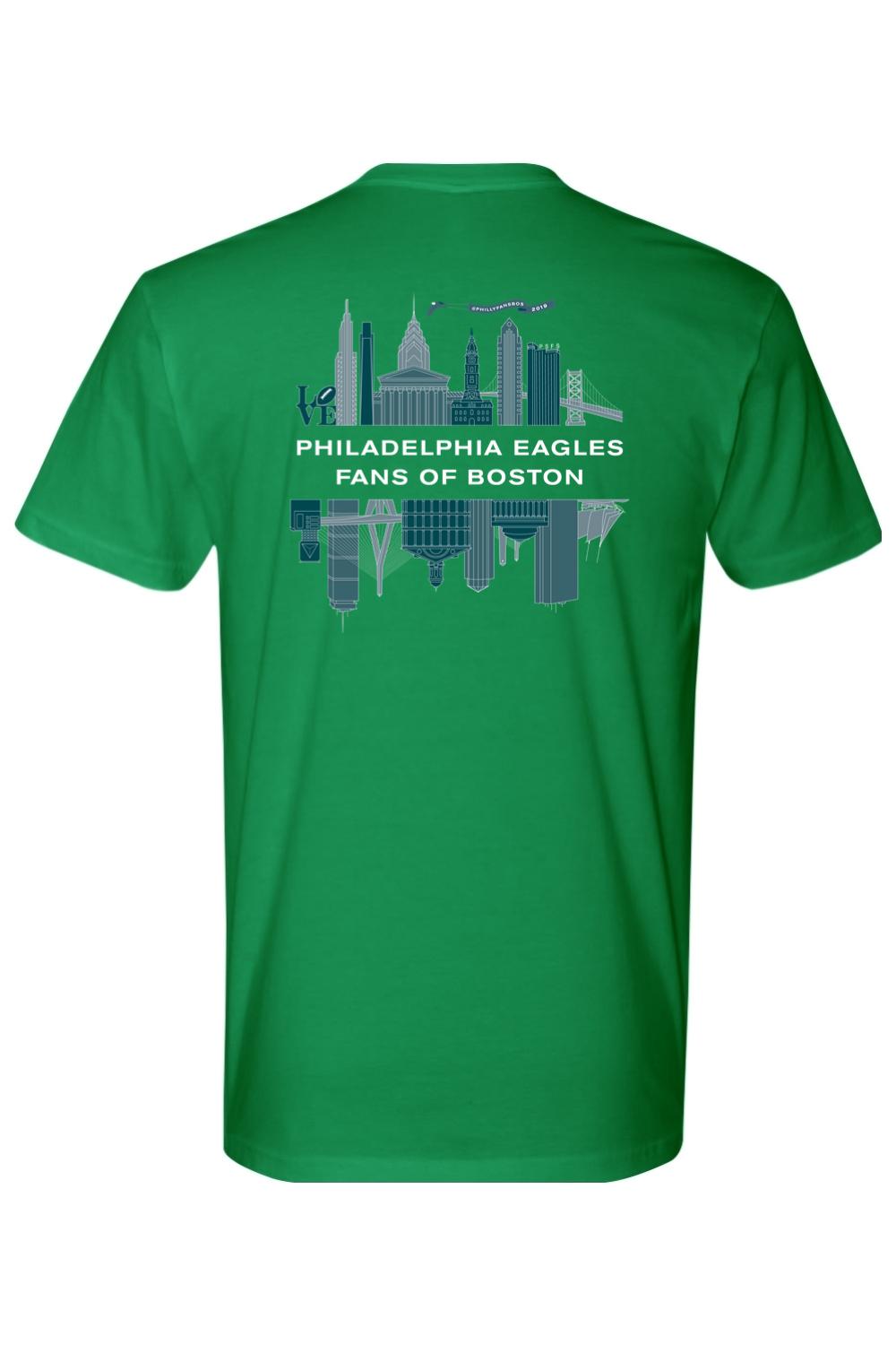 Green cotton t-shirt featuring a Philadelphia and Boston skyline graphic with the text Philadelphia Eagles Fans of Boston.