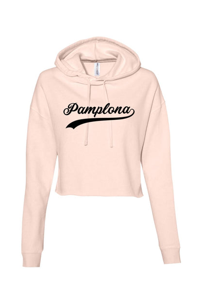 Light pink cropped athletic hoodie with a black Pamplona script logo, featuring a drawstring hood and soft cotton blend.