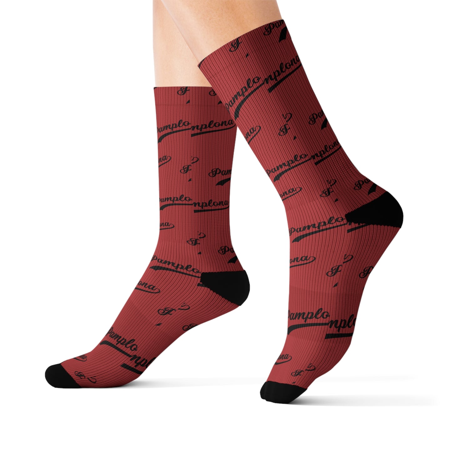 Red ribbed Pamplona socks with black text print, featuring cushioned black heels and toes on a unisex fit.