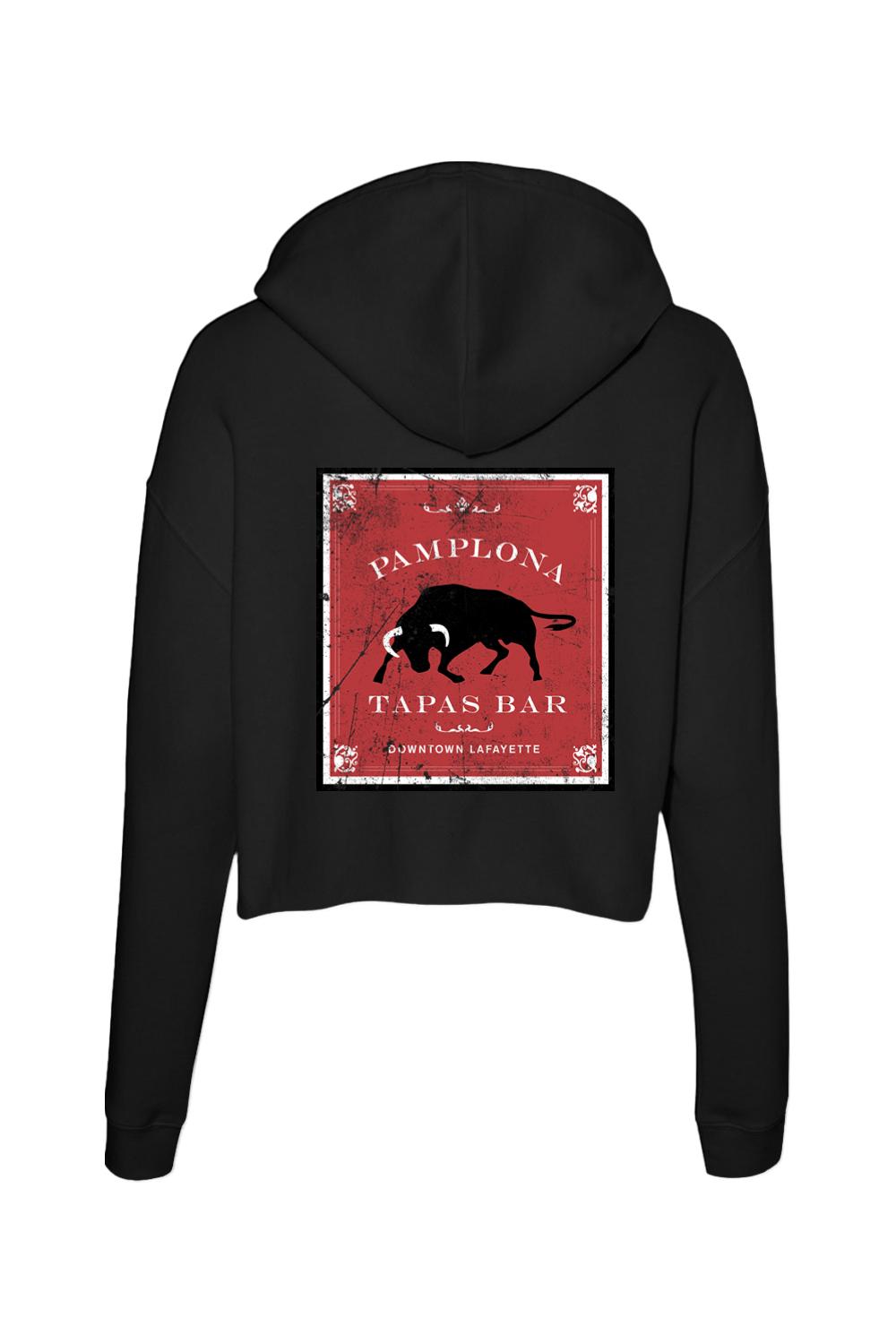 Black cropped hoodie featuring a red Pamplona Tapas Bar graphic with a bull design on the back.