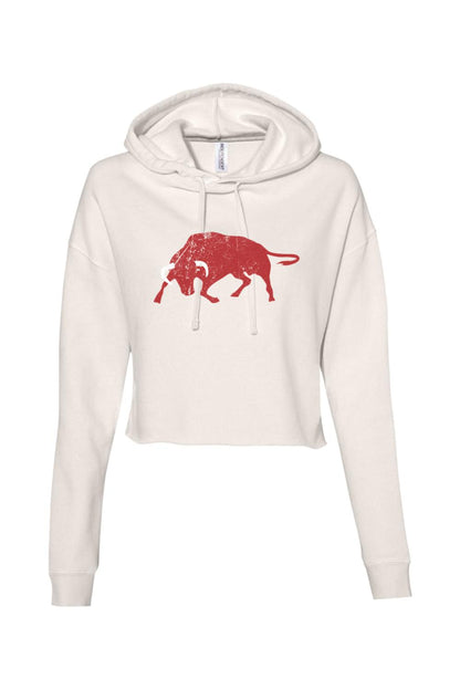 Off-white cropped hoodie with a distressed red bull graphic on the chest, featuring a drawstring hood and long sleeves.