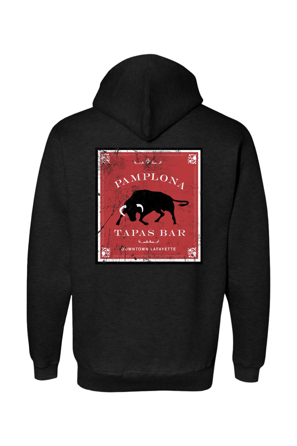 Black premium hoodie featuring a distressed red square graphic on the back with a bull and Pamplona Tapas Bar text.