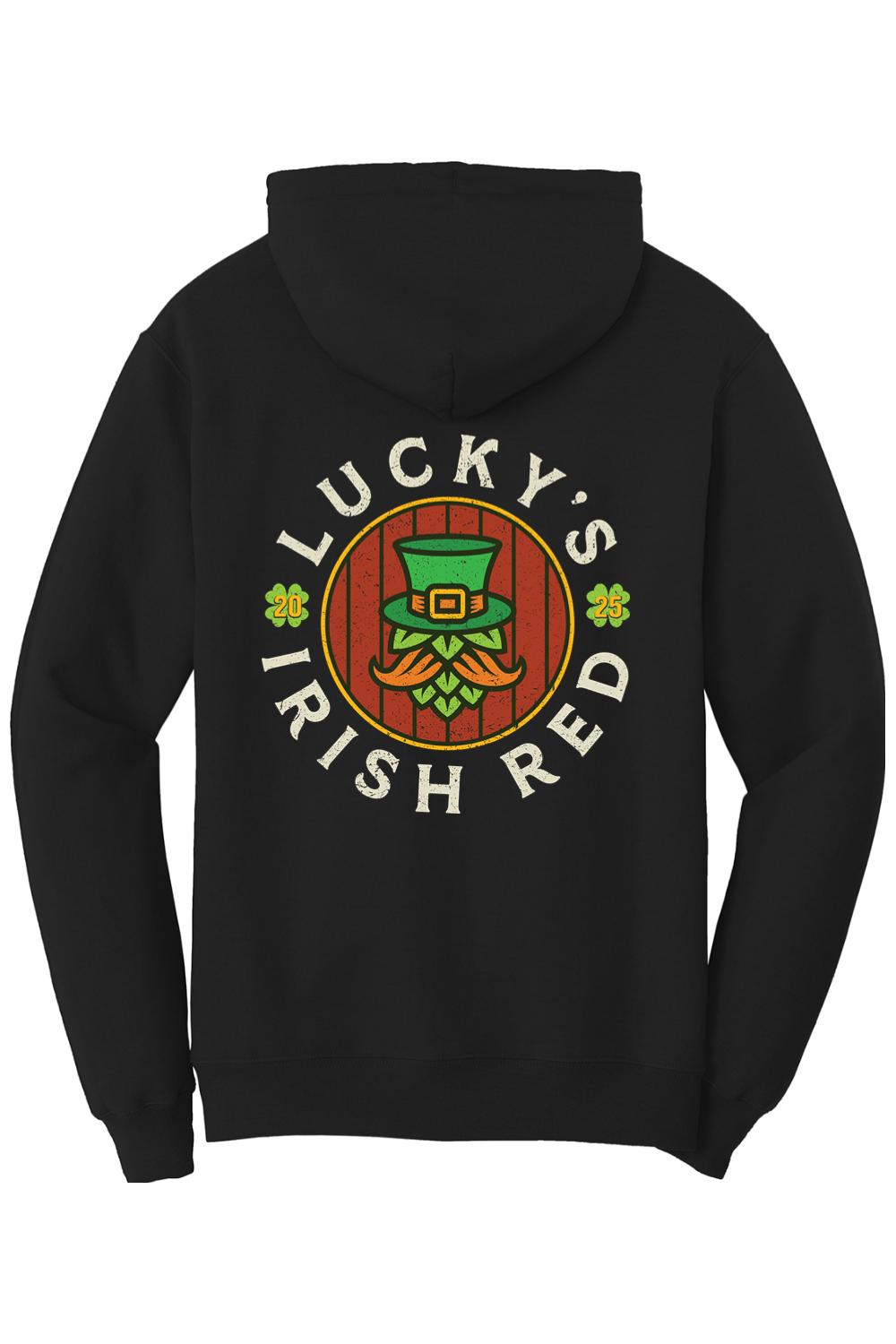Black cotton zip-up hoodie featuring a Lucky's Irish Red 2025 graphic with a leprechaun hat and hop design on the back.