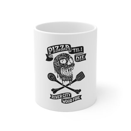 White 11oz ceramic mug featuring a black Pizza 'Til I Die skull design with crossed wooden spoons.