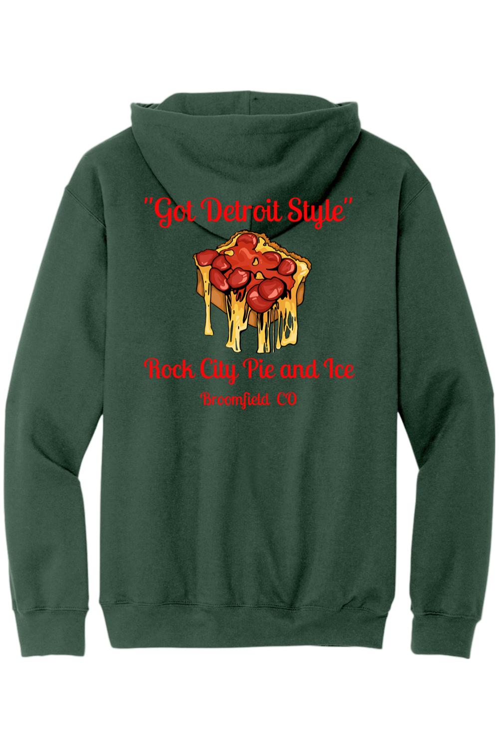 Forest green zip-up hoodie featuring a Detroit-style pizza graphic and Rock City Pie and Ice text on the back.