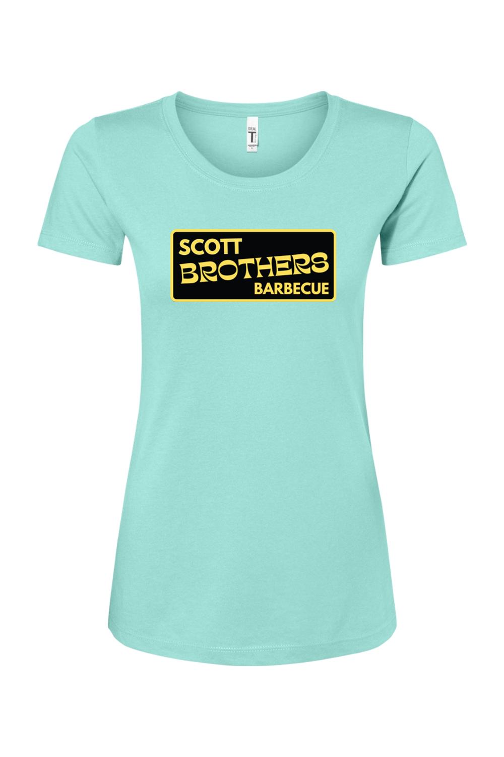 Light blue women's cotton-blend t-shirt featuring a black and gold Scott Brothers Barbecue logo on the chest.