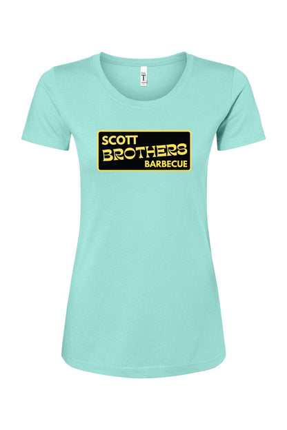Light blue women's cotton-blend t-shirt featuring a black and gold Scott Brothers Barbecue logo on the chest.
