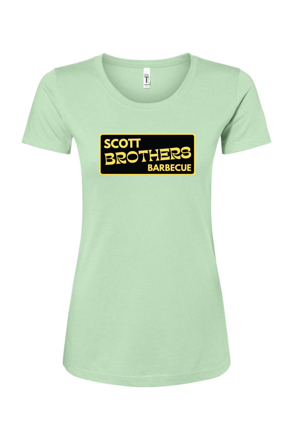 Light green women's cotton-blend t-shirt featuring a black and gold Scott Brothers Barbecue logo on the chest.