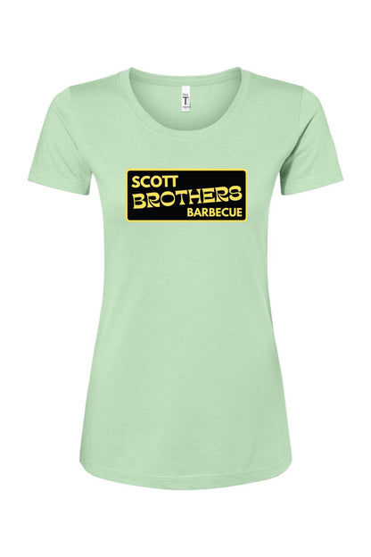 Light green women's cotton-blend t-shirt featuring a black and gold Scott Brothers Barbecue logo on the chest.