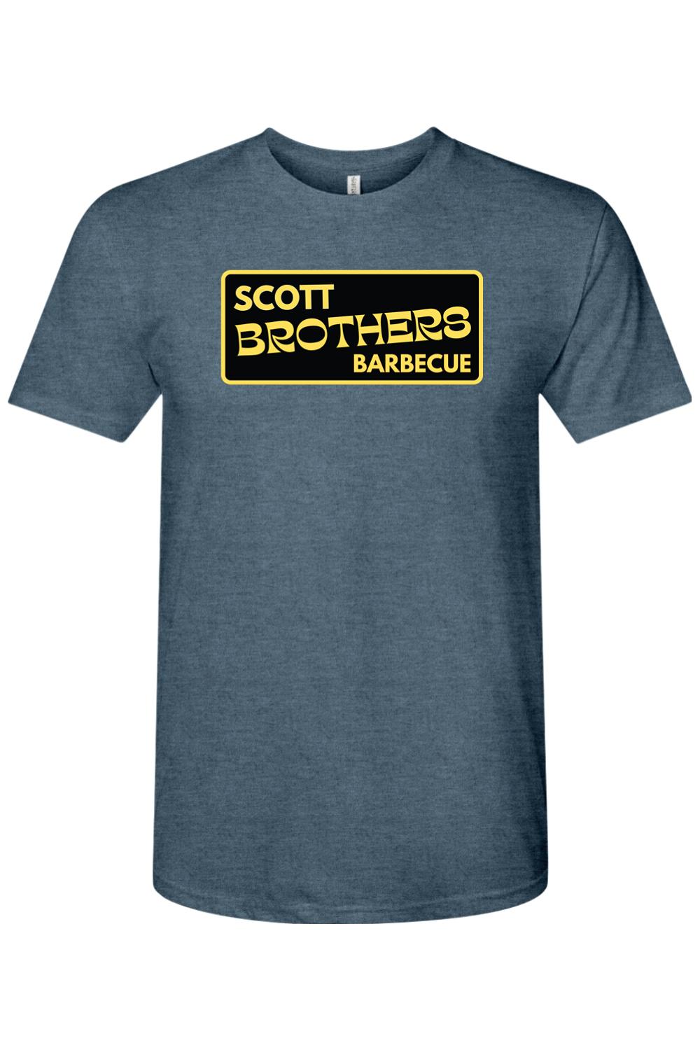 Heather blue triblend t-shirt featuring a black and gold Scott Brothers Barbecue logo on the chest.
