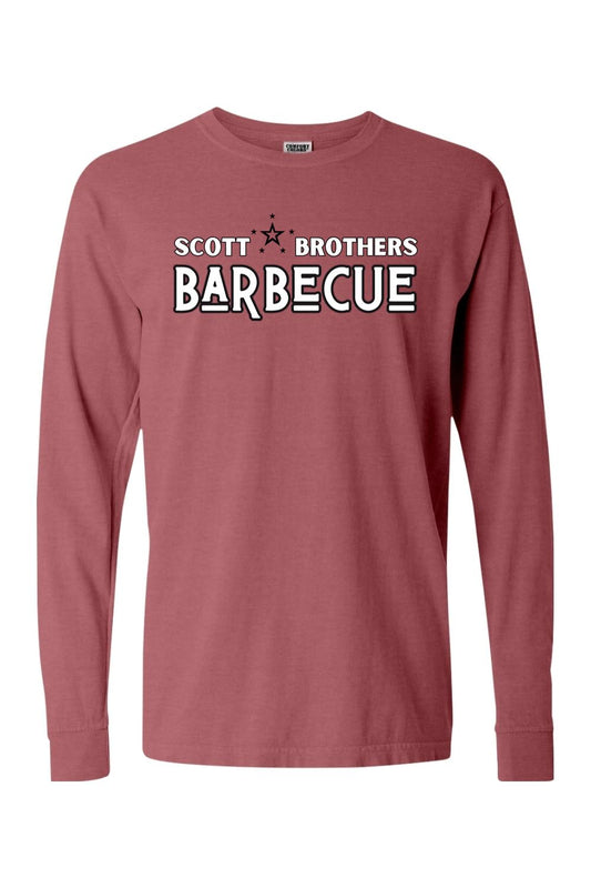 Brick red Comfort Colors long sleeve t-shirt featuring a black and white Scott Brothers Barbecue logo on the chest.