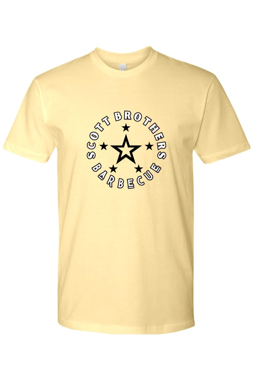 Soft yellow cotton t-shirt featuring a black Scott Brothers Barbecue star logo graphic on the chest.