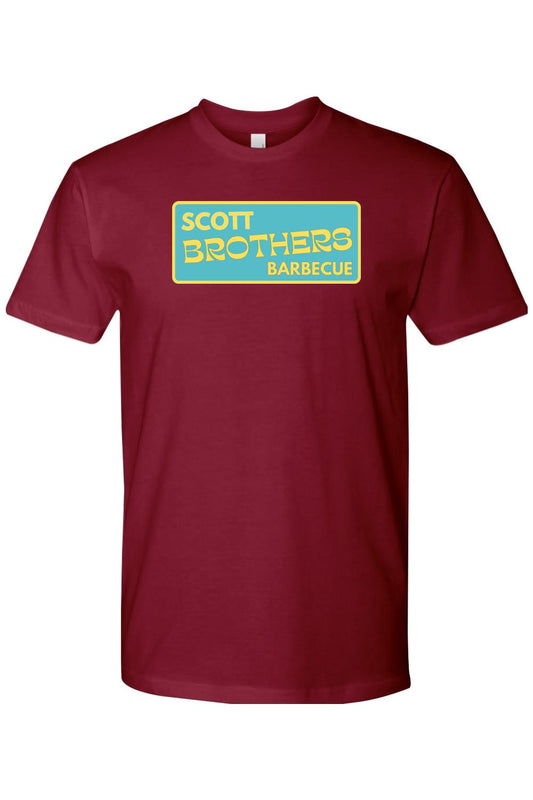 Maroon cotton t-shirt featuring a rectangular teal logo with yellow Scott Brothers Barbecue text.