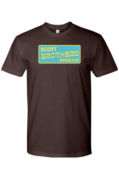 Brown cotton t-shirt featuring a rectangular teal logo with yellow Scott Brothers Barbecue text.