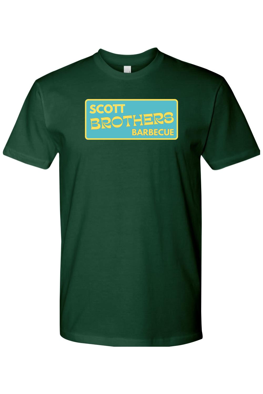 Dark green cotton t-shirt with a yellow and teal Scott Brothers Barbecue logo graphic on the chest.