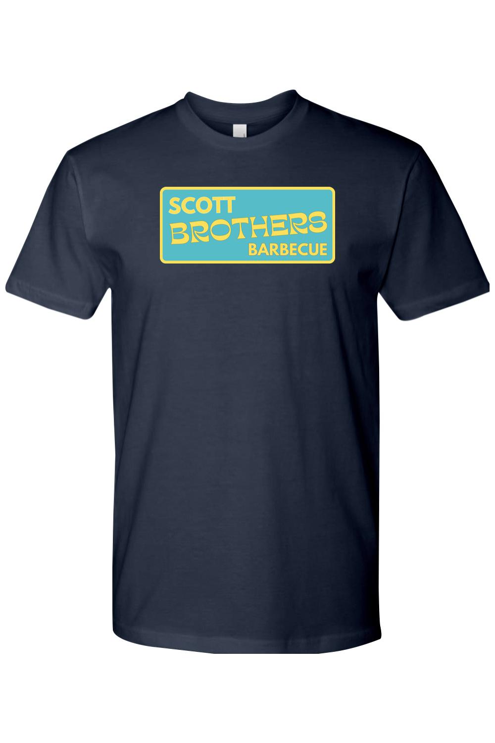 Navy blue cotton t-shirt featuring a yellow and teal Scott Brothers Barbecue logo graphic on the chest.