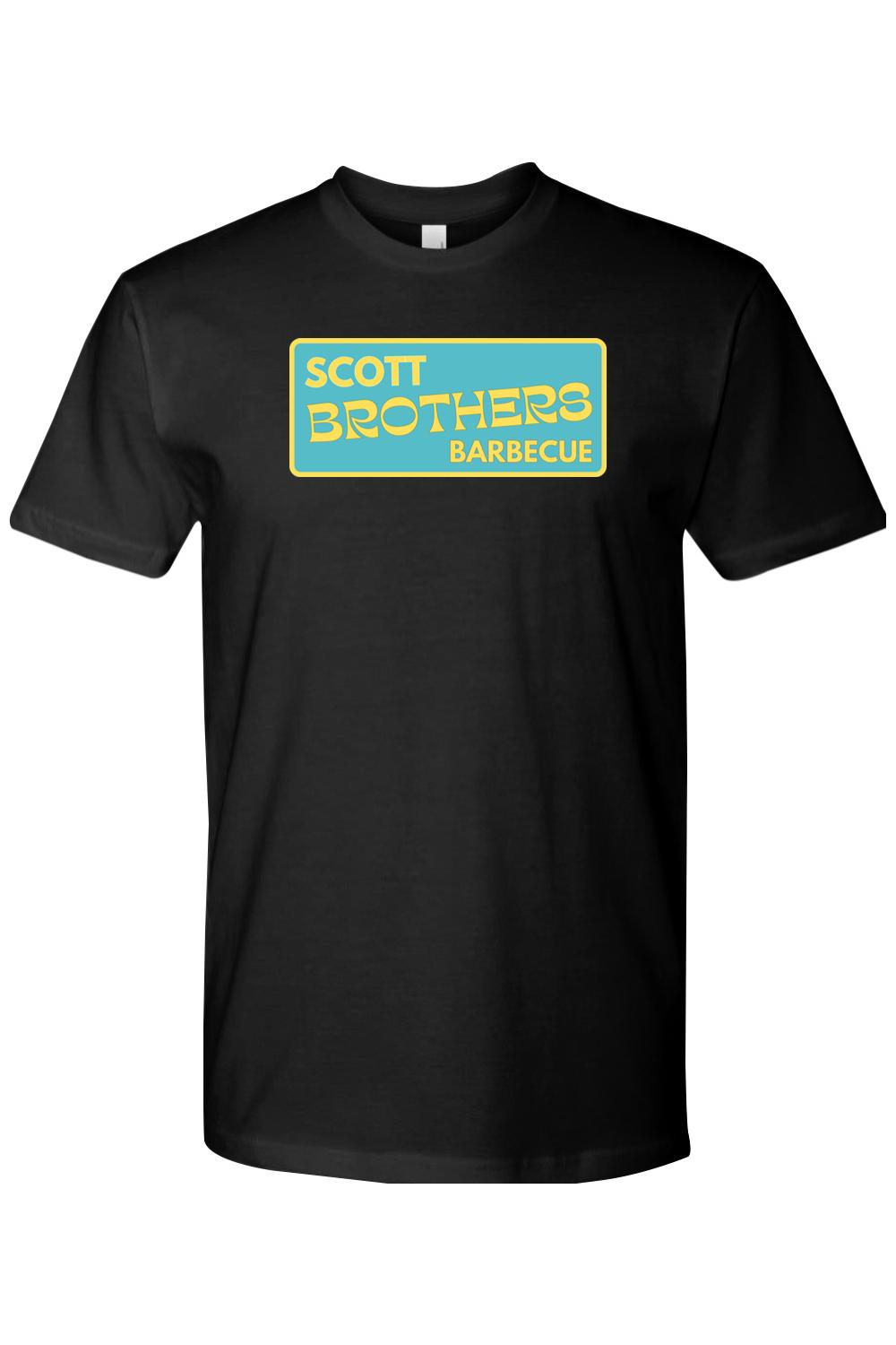 Black cotton t-shirt featuring a yellow and teal Scott Brothers Barbecue logo on the chest.