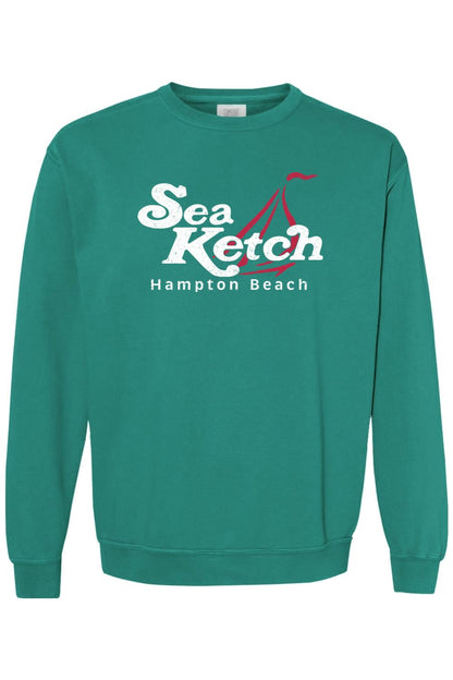 Teal Comfort Colors crewneck sweatshirt featuring a white Sea Ketch Hampton Beach graphic with a red sailboat icon.